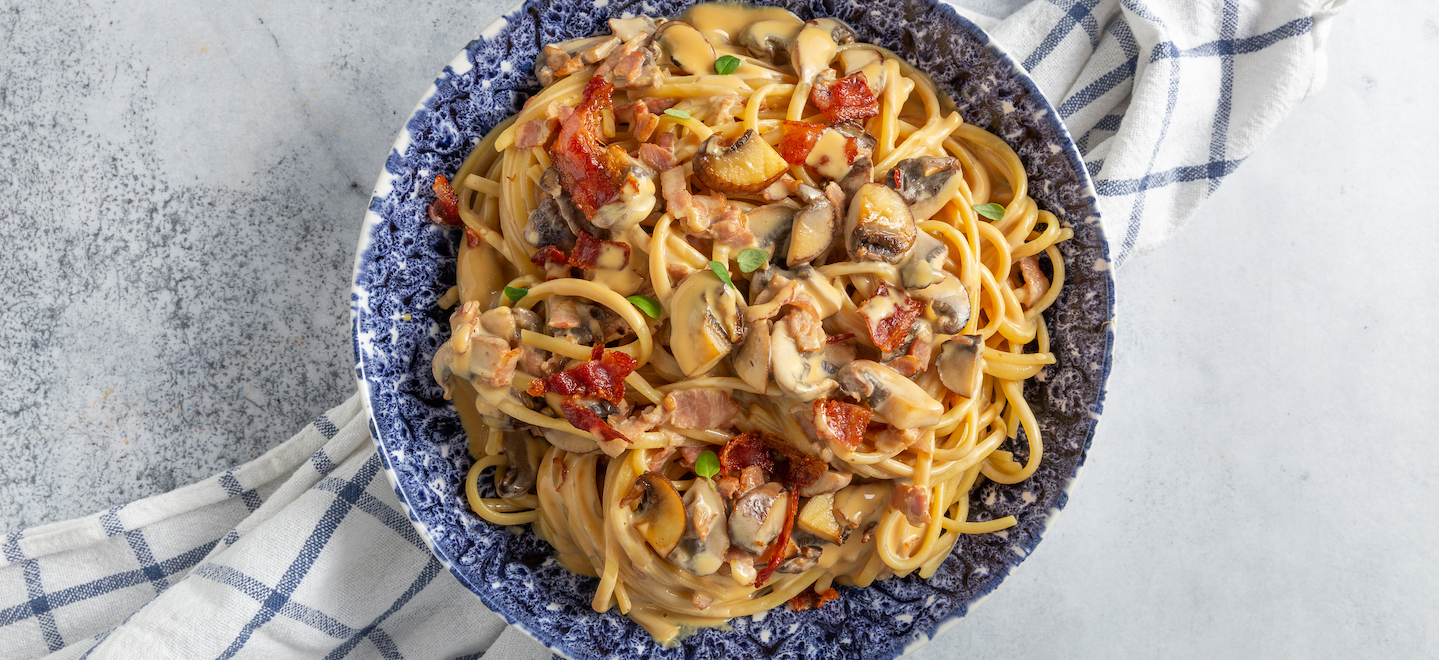 Cremige Pilz-Tagliatelle mit Speck